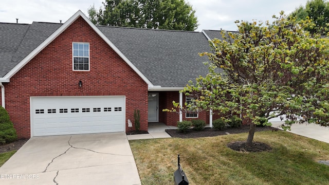 view of front of property with a garage and a front yard