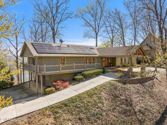 view of front facade featuring a porch and a carport