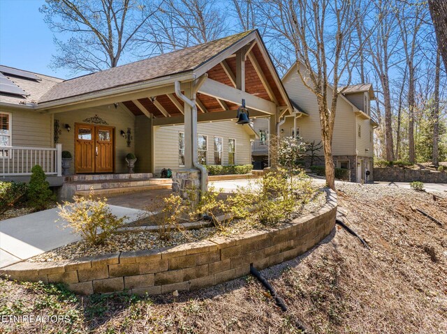 exterior space featuring covered porch and ceiling fan