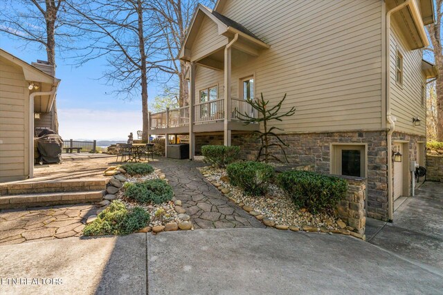 exterior space with a patio and a deck