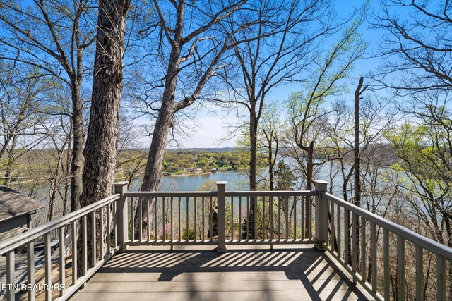 wooden terrace with a water view