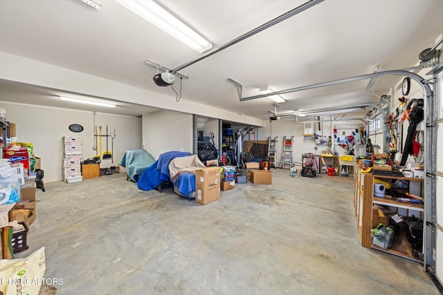 garage featuring a workshop area and a garage door opener