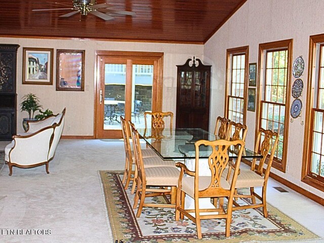 carpeted dining space featuring a wealth of natural light, ceiling fan, wooden ceiling, and lofted ceiling