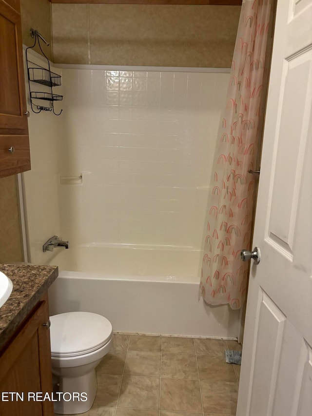 full bathroom featuring vanity, toilet, tile patterned floors, and shower / bath combination with curtain