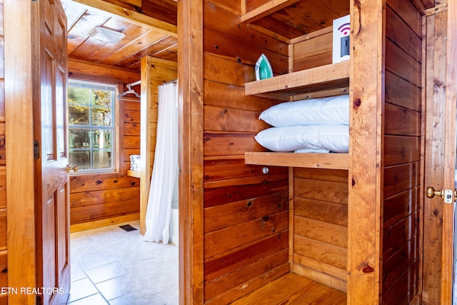 interior space with wooden walls and wood ceiling