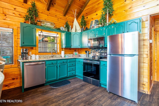 kitchen featuring wooden walls, vaulted ceiling with beams, appliances with stainless steel finishes, and dark hardwood / wood-style flooring