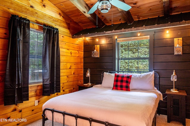 bedroom with carpet floors, wooden ceiling, lofted ceiling, ceiling fan, and wooden walls