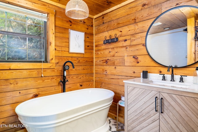 bathroom featuring vanity, a bathing tub, wooden walls, and wood ceiling