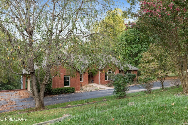 view of property hidden behind natural elements