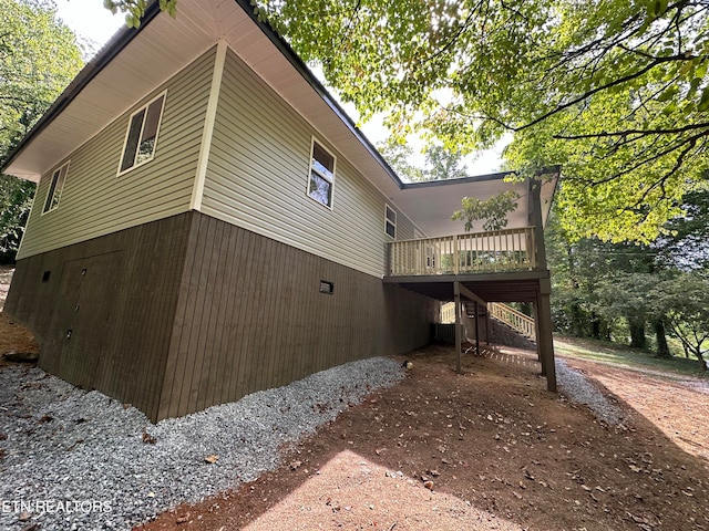 view of property exterior featuring a deck