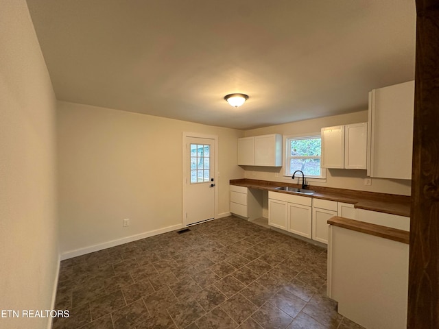 kitchen with white cabinets and sink