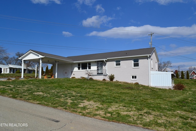 ranch-style house with a front lawn