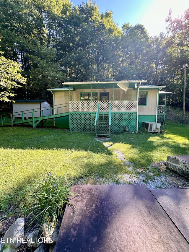 exterior space featuring covered porch and a front lawn
