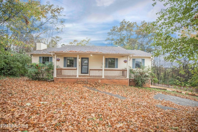 ranch-style house featuring covered porch