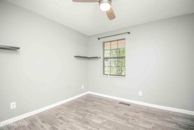 unfurnished room with light hardwood / wood-style flooring and ceiling fan