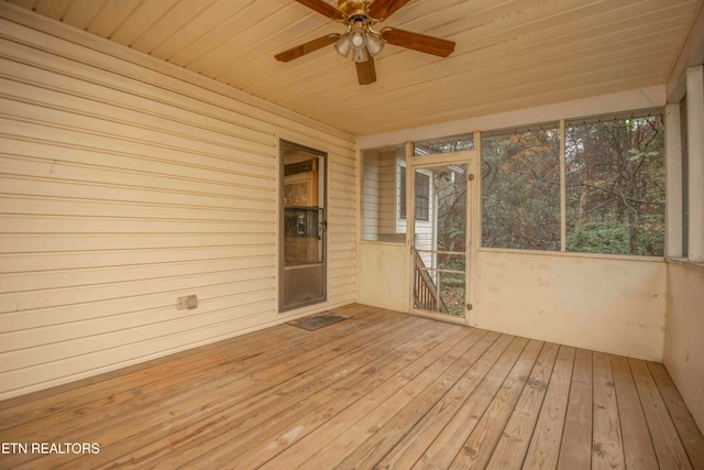 unfurnished sunroom featuring ceiling fan and wooden ceiling