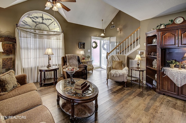 living room featuring ceiling fan, high vaulted ceiling, and hardwood / wood-style floors