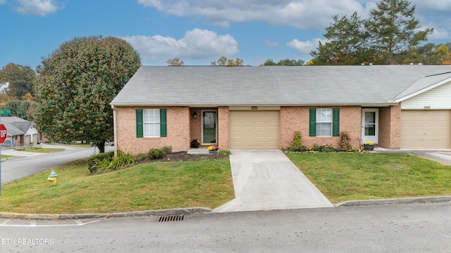 view of front of property featuring a garage and a front lawn