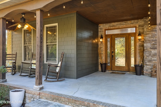 doorway to property featuring covered porch