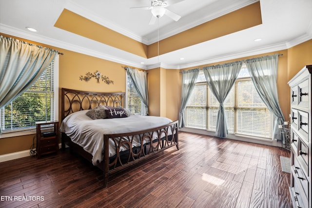 bedroom with multiple windows, hardwood / wood-style floors, and ceiling fan