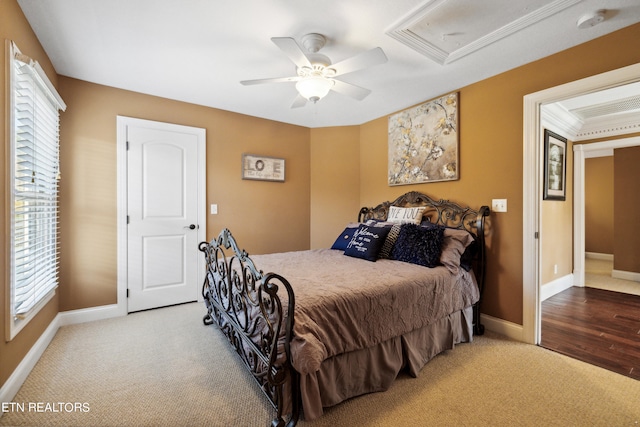 bedroom with ceiling fan, hardwood / wood-style flooring, and crown molding