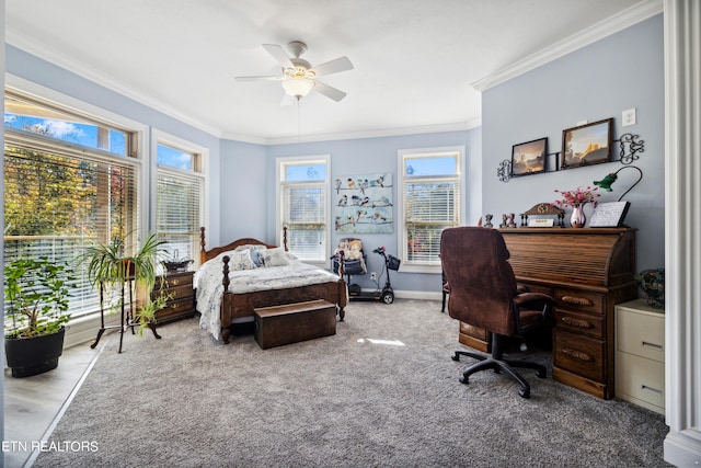 carpeted bedroom with ceiling fan and ornamental molding