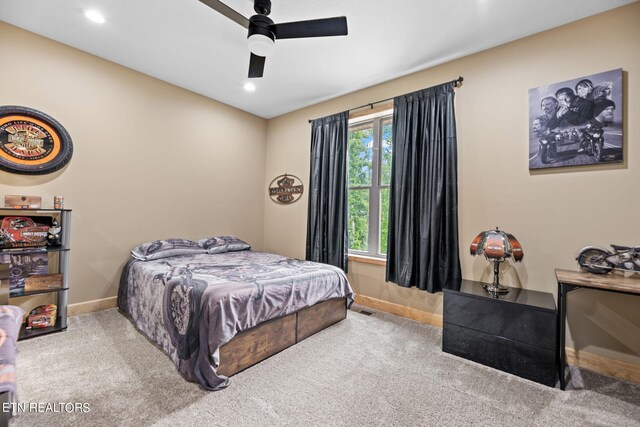 bedroom with ceiling fan and carpet flooring