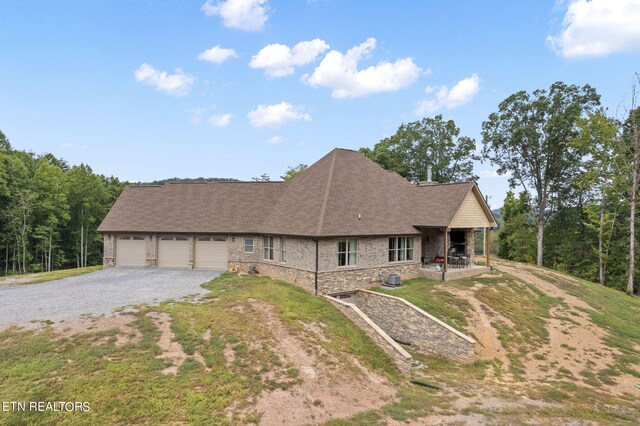 view of front of property with a garage and a front yard