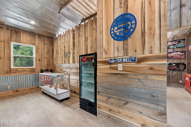 interior space with wooden walls and wood-type flooring