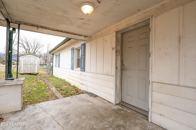 view of exterior entry featuring a patio