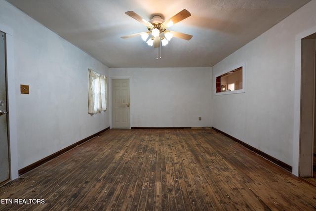 unfurnished room featuring dark hardwood / wood-style floors and ceiling fan