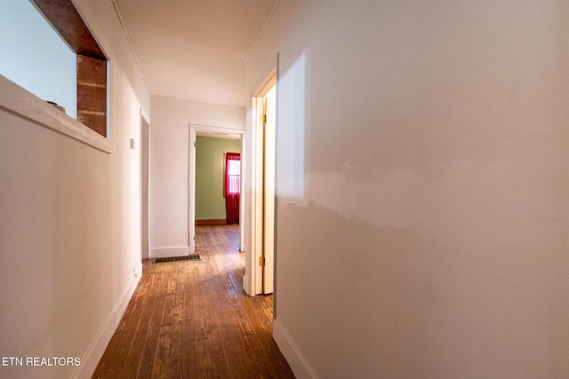 hall with hardwood / wood-style floors