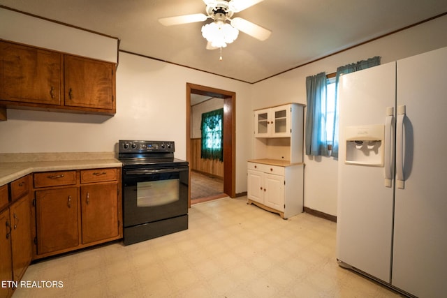 kitchen featuring black range with electric stovetop, ceiling fan, and white refrigerator with ice dispenser