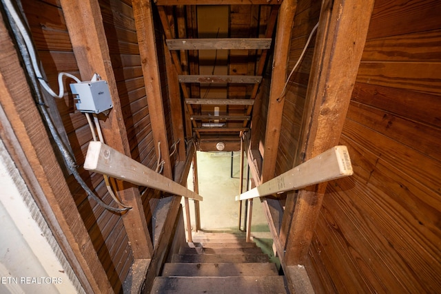 staircase with hardwood / wood-style floors