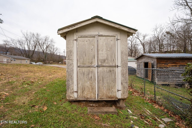 view of outbuilding with a yard