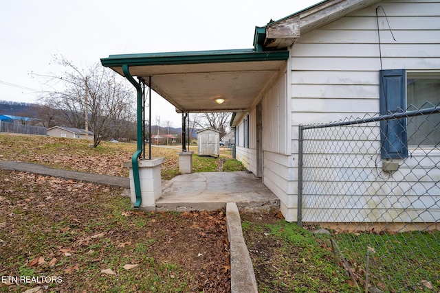 view of property exterior with a storage shed