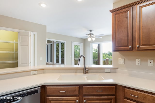 kitchen featuring ceiling fan, sink, and stainless steel dishwasher