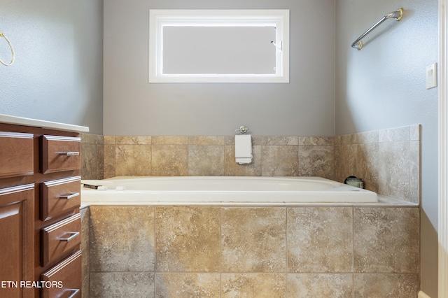 bathroom featuring tiled bath