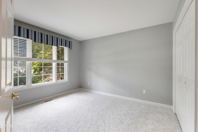 unfurnished bedroom with a closet