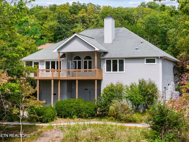 back of house with a balcony