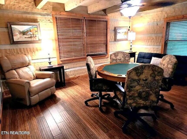 dining space featuring ceiling fan, beam ceiling, and hardwood / wood-style floors