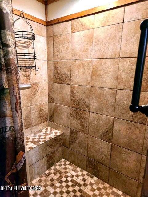 bathroom with curtained shower