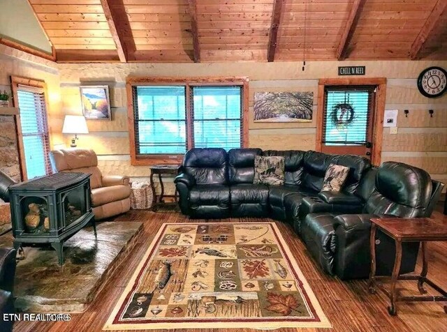 living room with wood ceiling, hardwood / wood-style floors, and a wood stove