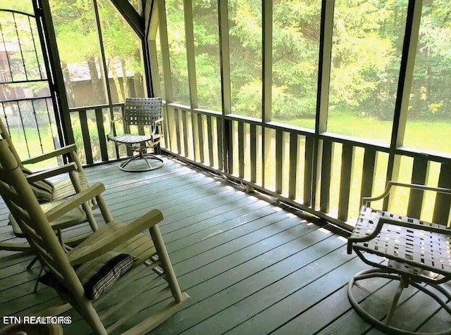 unfurnished sunroom featuring a wealth of natural light