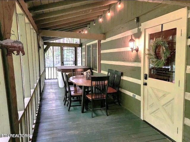 sunroom with lofted ceiling