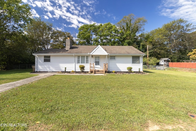 ranch-style house with a front lawn