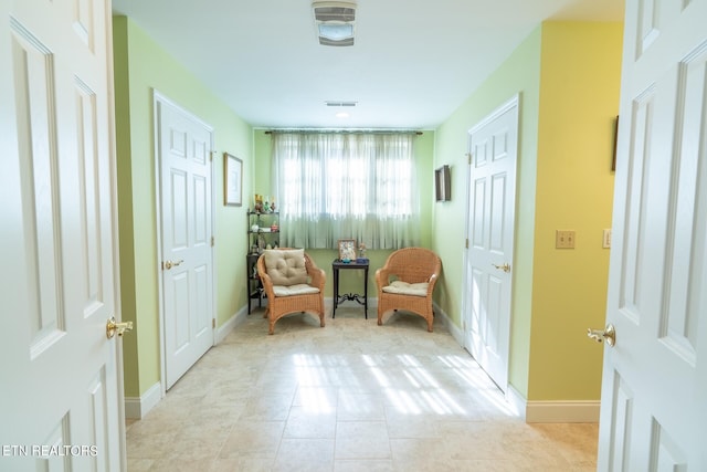 sitting room with light tile patterned flooring