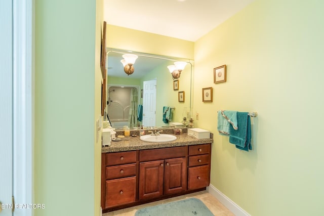 bathroom with tile patterned floors and vanity