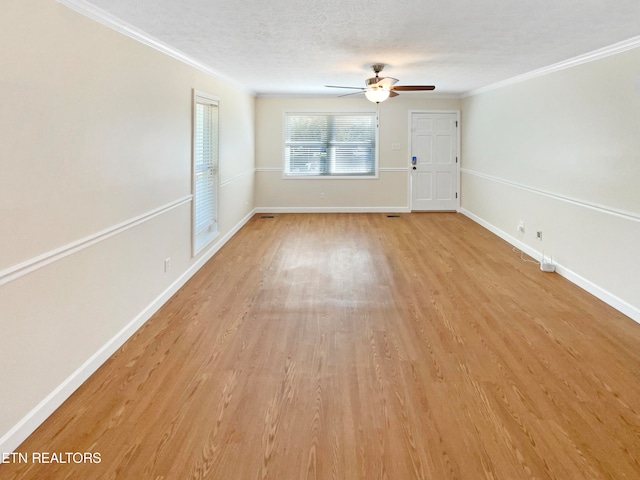 unfurnished room featuring ceiling fan, ornamental molding, light hardwood / wood-style floors, and a textured ceiling