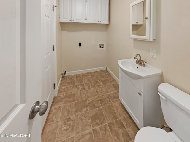 bathroom with toilet and vanity